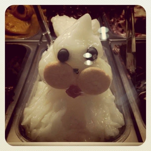 A dog sculpted from lemon sorbetto